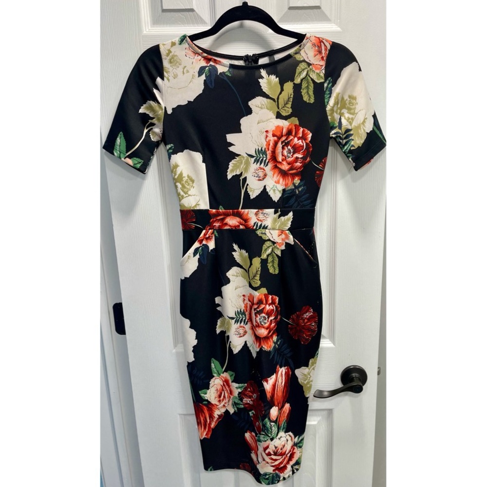Beautiful brand new, never worn cocktail length dress.